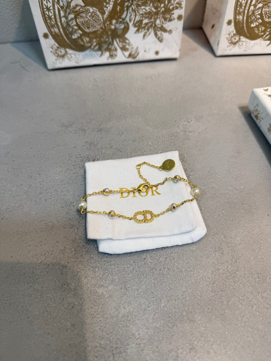 Pulsera CD logo y Perlas