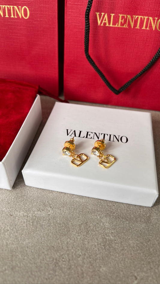 Aretes VLNTINO dorados con detalle brillante pequeños