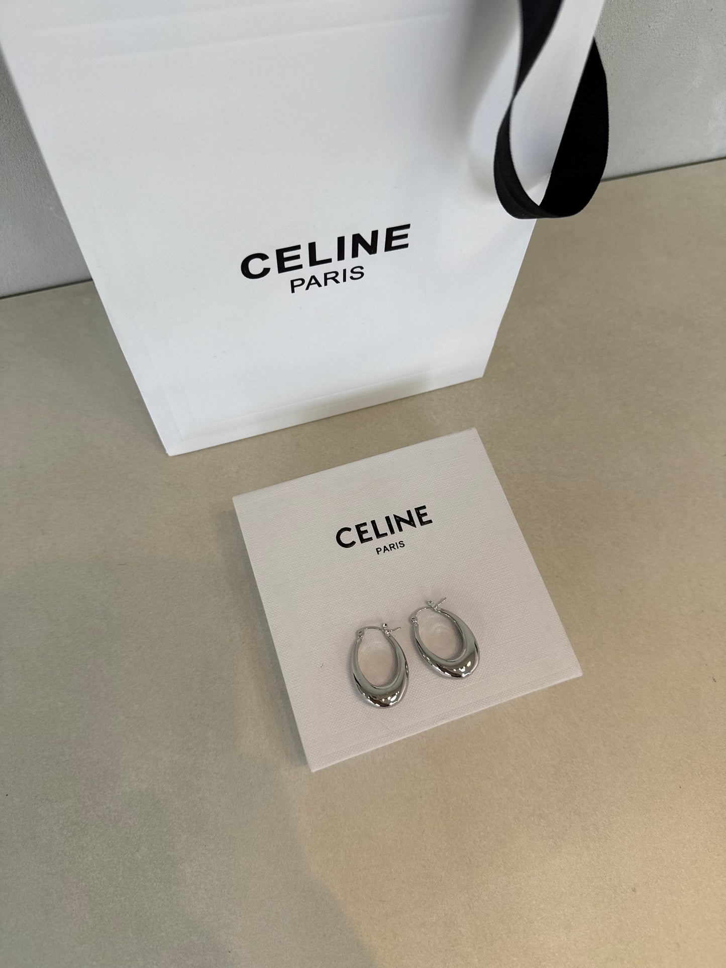 Aretes CEL plateados