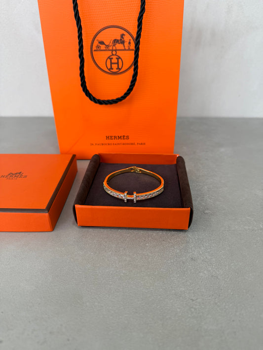 Pulsera HER dorada y diamantes