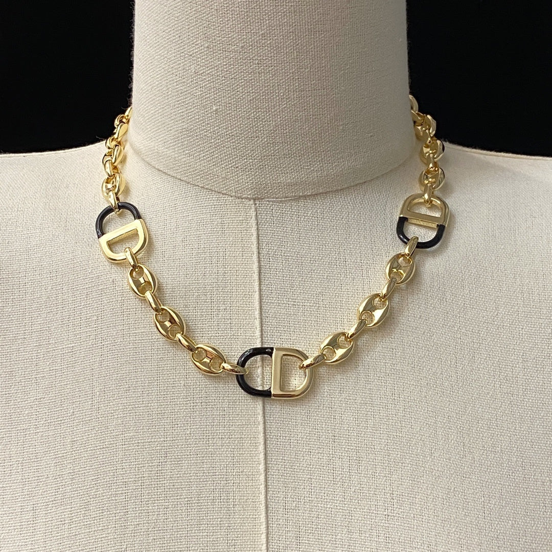 Collar CD logo negro-dorado -5028